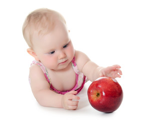 Fototapeta na wymiar The little baby with red apples