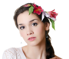Obraz na płótnie Canvas Portrait of the beautiful girl with flowers in hair