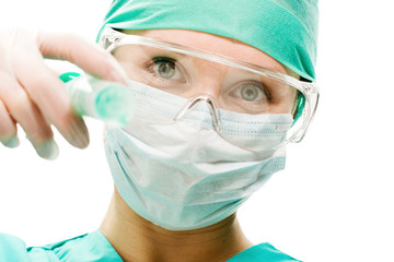 Surgeon woman with syringe making injection,