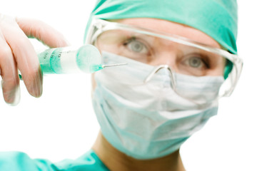 Surgeon woman with syringe making injection,