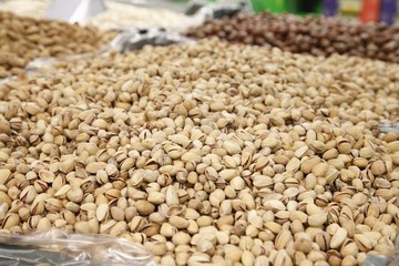 Piles of pistachio for sale in supermarket