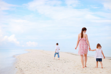 Mother and two kids on beach