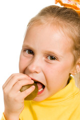 cute girl biting an kiwi