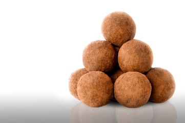 Chocolate truffles on white background