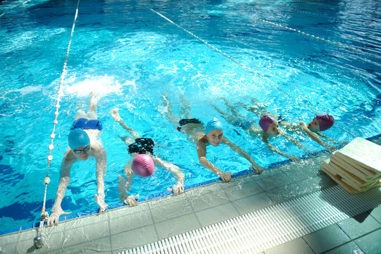 happy childrens at swimming pool