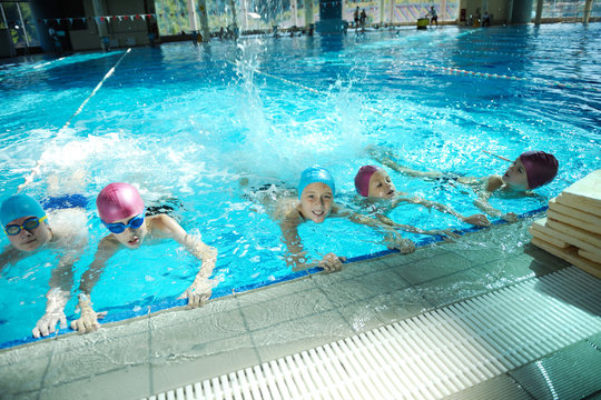 happy childrens at swimming pool