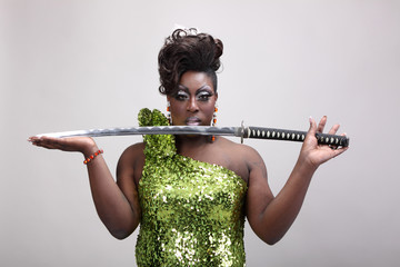 Drag queen holding a samurai sword. © Peter Kim