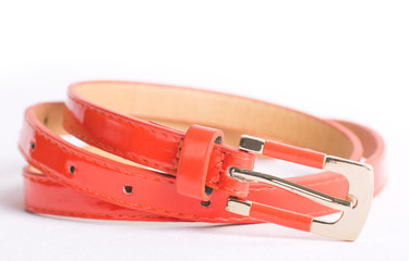 Fashionable colorful belts on white background
