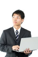 Young asian businessman using a laptop computer