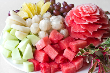 Watermelon carvings on a plate and famous tropical fruits