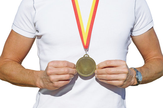 man holding medal before breast