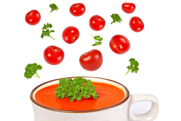 Tomato soup, herbs and tomatoes isolated on white