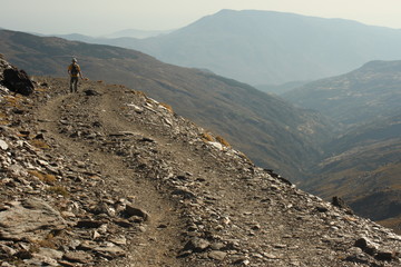 rambler on a winding footpath in Sierra Nevada, Spain