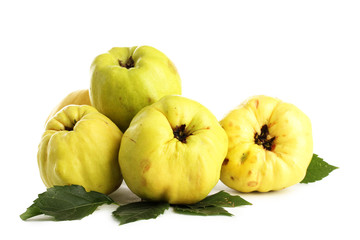 sweet quinces with leaves, isolated on white