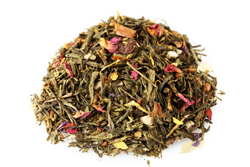 aromatic green dry tea with fruits and petals, isolated on