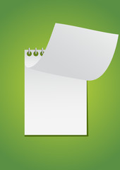 notebook open on green leaf background