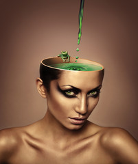 woman with lake and frog in head