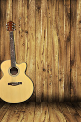 acoustic guitar on wood background