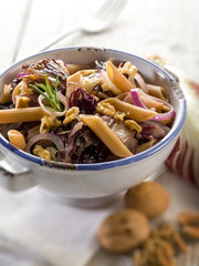 pasta with chicory and nuts, selective focus