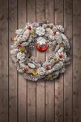 White Christmas wreath on wooden door