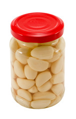 Glass jar pot of preserved garlic isolated