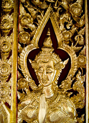 Golden lady in  traditional Thai style carving art