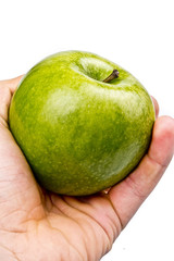 Hand giving the green apple