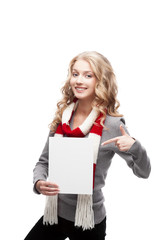 Fototapeta premium young smiling woman pointing at sign