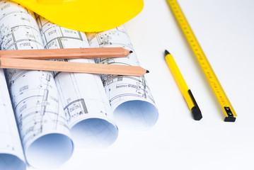 architect concept and rolls of architectural drawings