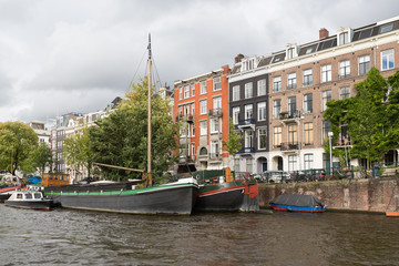 City view of historic Amsterdam, seen from river Amstel