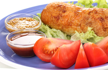 Tasty meat cutlet with garnish on plate close-up