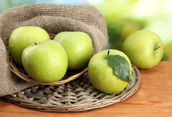 Ripe green apples in basket