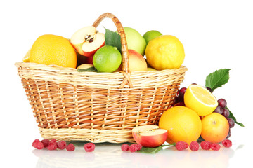 Assortment of exotic fruits in basket, isolated on white