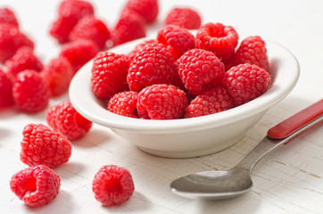 A small bowl of freshly picked raspberries.