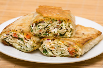 Pita bread wrapped with cottage cheese and vegetables