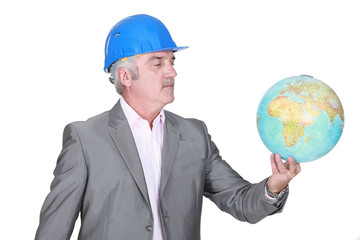 Engineer holding a globe