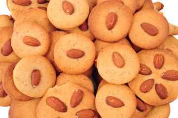 Pile of homemade almond biscuits isolated on white background