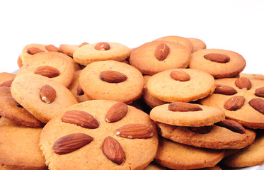 Pile of homemade almond biscuits isolated on white background