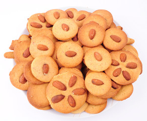 Naklejka premium Pile of almond cookies on white background