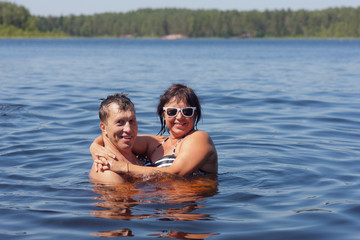 Fototapeta na wymiar Portrait of couple in the water