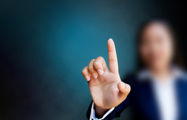 hand of business women pushing a button on a touch screen interf