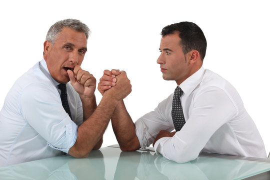 Businessmen doing arm wrestling