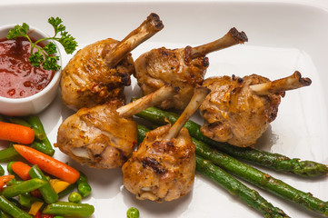 chicken legs with asparagus and ketchup