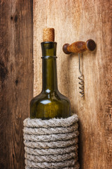 Naklejka premium bottle of wine wrapped with rope
