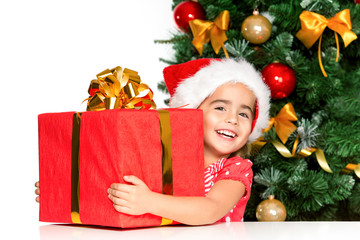 Happy little girl smiling with gift