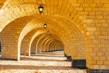 The arched stone colonnade with lanterns