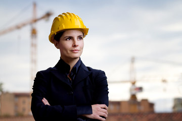 female engineer  over building yard background