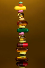 Capsules and pills on orange background