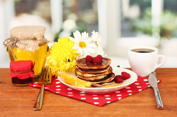 delicious sweet pancakes on bright background