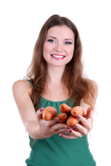 Beautiful woman with carrot isolated on white